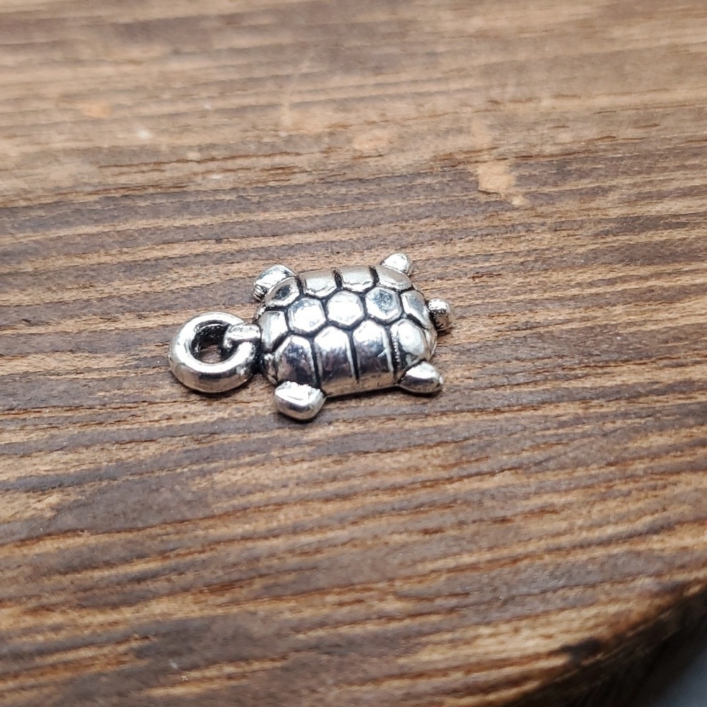 P115 turtle charm